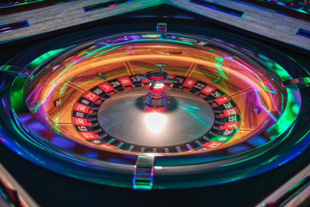 Colorful illuminated roulette wheel close-up